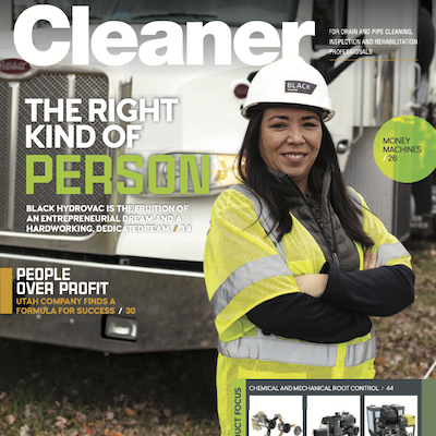 A magazine cover of "Cleaner" featuring a smiling woman in construction gear with the headline "The Right Kind of Person."